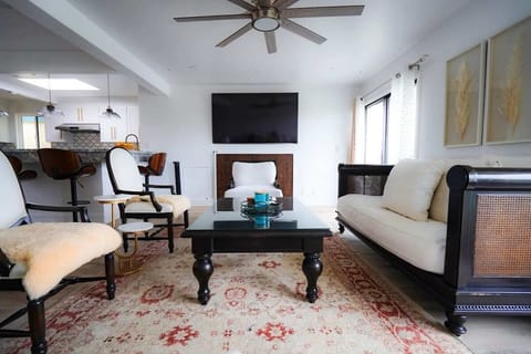 Bright open living room with smart TV and comfortable seating