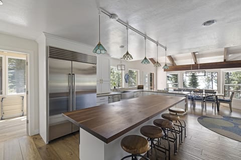 Fully stocked kitchen and island for group cooking.