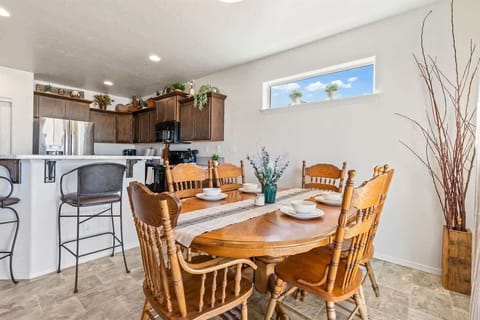 Sturdy Dining table with 8 chairs total (6 pictured)