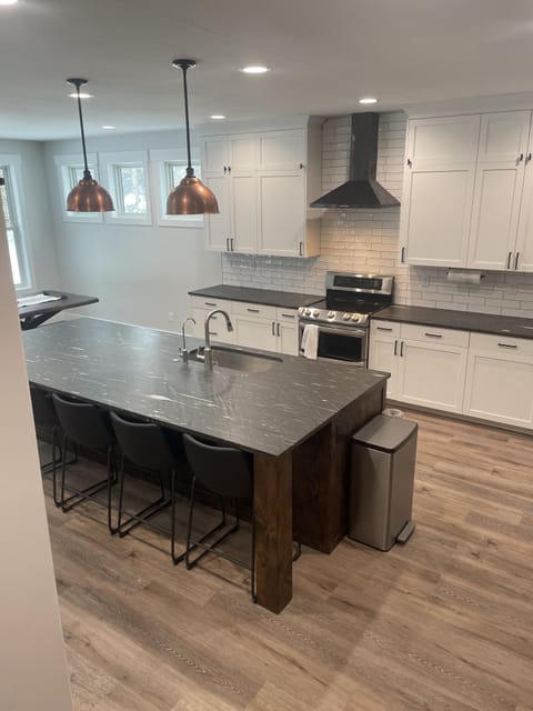 Beautiful rubbed granite counters, seating for 5 on barstools