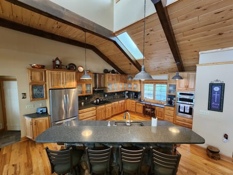 Huge open Kitchen with large refrigerator
