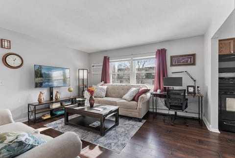 Living View 1 - large space for lounging, playing board games and watching your favorite shows. Features 60` Smart HDTV where you can log in to your favorite apps like Netflix, Hulu, Max, etc. Includes desk, computer chair and monitor.