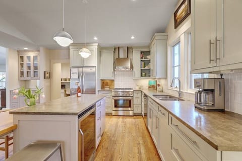 Sleek and modern kitchen with high-end appliances and ample counter space.