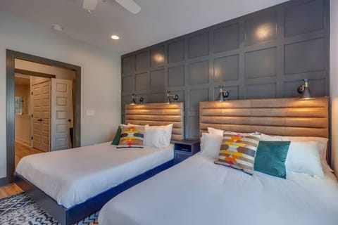 Each primary suite includes a small office, walk-in closet, and spa-like bathroom.