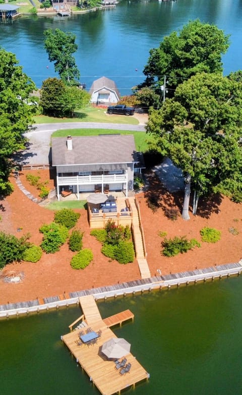 Drone view of property and private peninsula. 