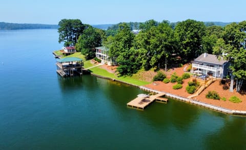 Beautiful deep water cove home is behind no wake zone with big water nearby. 