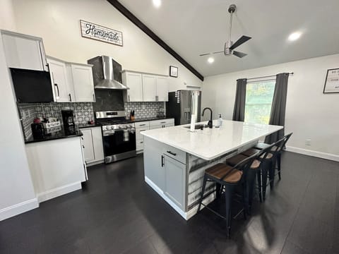 Fully Stocked Kitchen with Island Seating.