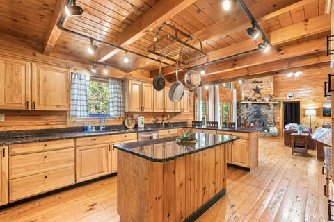 Fully equipped kitchen with modern amenities, ready for home-cooked meals and unforgettable feast.