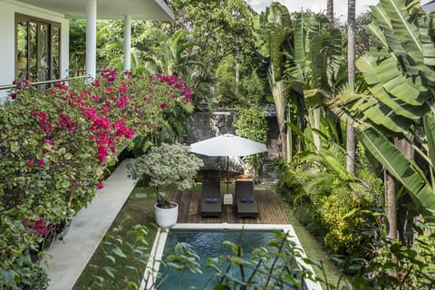 Bedrooms are located on the second floor overlooking the pool and garden