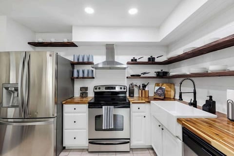 Just like the rest of the house this newly renovated kitchen is both beautiful and functional. Stainless steel appliances, farmhouse kitchen sink, butcher block countertops and very well provisioned. Great for grabbing a small snack or making a meal.