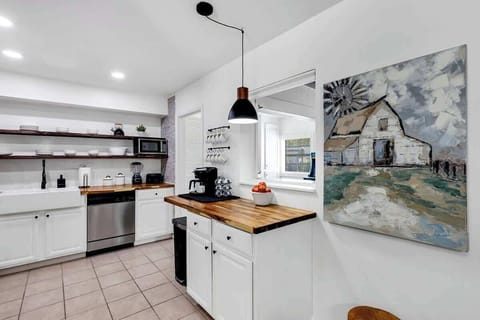 Breakfast / coffee nook great for extra space. Stainless steel appliances, farmhouse kitchen sink, butcher block countertops and very well provisioned. Great for grabbing a small snack or making a meal.