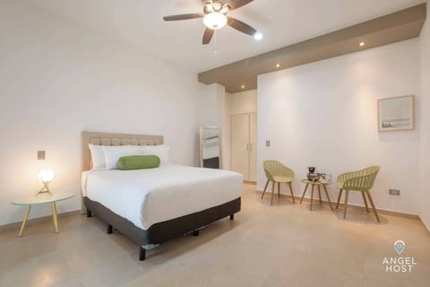 Queen-size bed available with a bedside nightstand and reading lamp.