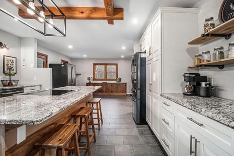 Large dining table seating 8-10 will go underneath the window