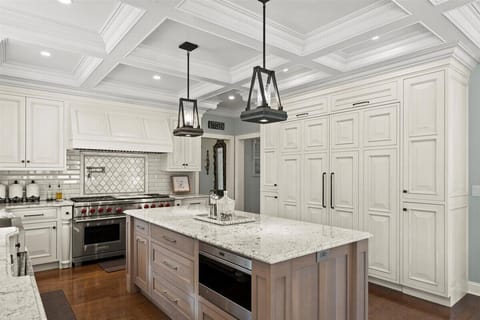 Large kitchen with a center island, a double stove