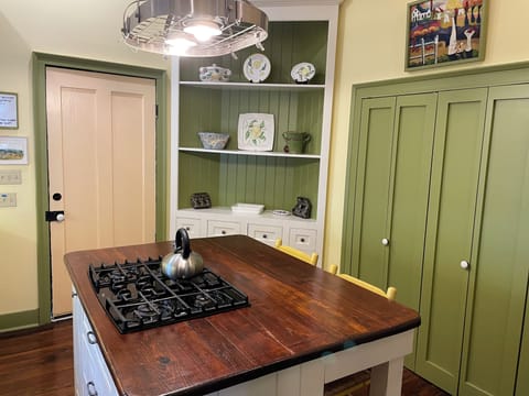 Kitchen - There's a washer and dryer behind the green folding doors.