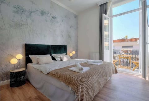 Bedroom 2 with en suite bathroom and  balcony