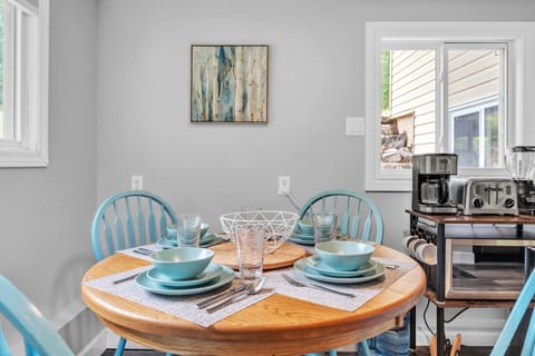 Our dining table is set for 4 people but does expand with a leaf and we have extra chairs if you have a party of 6.