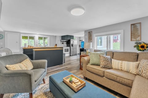 Open concept living keeps everyone together during their cottage stay.