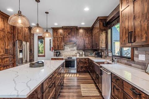 Modern Rustic Kitchen With Full Wall Tile,  Oversized Range