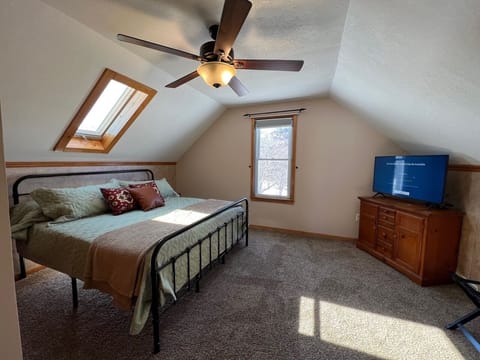 upstairs master with king bed and smart tv with airplay