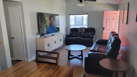 Living room with 75" Samsung smart TV. Spectrum with local channels included. 