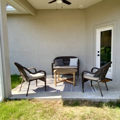 Backyard patio has premium charcoal grill