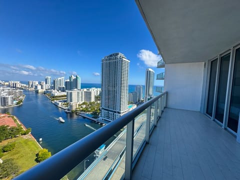 Private balcony with outdoor seating and skyline views.
