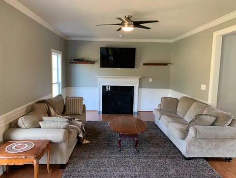 Living room/TV room adjacent to kitchen.