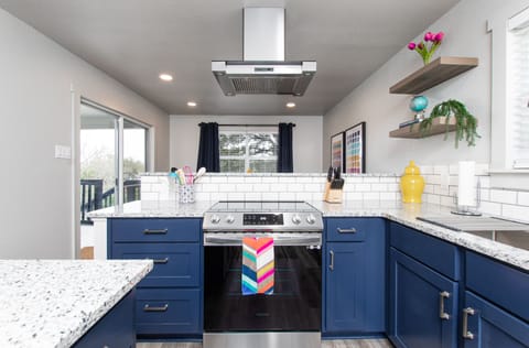 Electric range with vent-a-hood