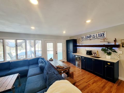 View of the living room, bar and deck.