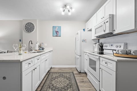 Fully equipped kitchen with modern appliances—perfect for home-cooked meals.