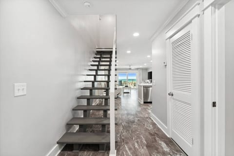 Upon entering the home, you are welcomed by an open-floor concept and ocean views.