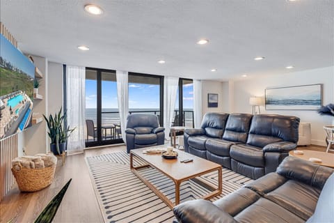 Bright and Inviting Living Area with Floor-to-Ceiling Gulf Views
