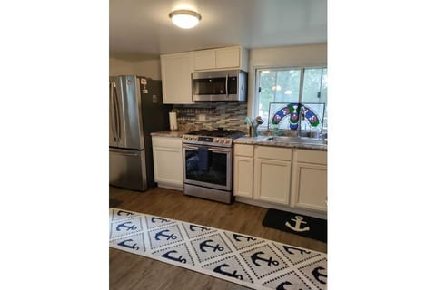 5 Burner gas stove & convection oven. Microwave too! Refrigerator has ice maker.