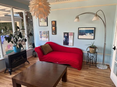Sunroom with an exit to the patio and pool area.