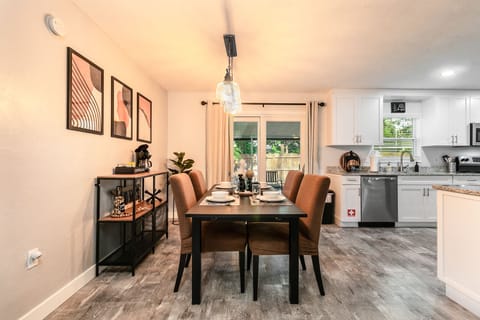 The coffee bar and dining table are located close to the kitchen for mingling!