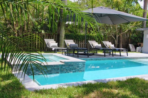 Tanning, swimming, relaxing, and playing in our peaceful, verdant backyard. Blissful stay assured