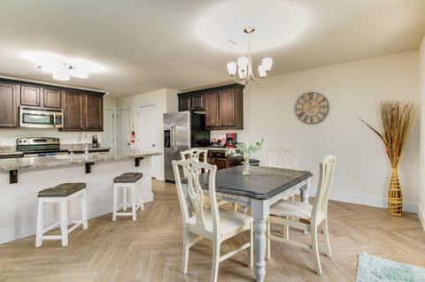 Gather around the charming dining table, perfectly sized to seat four for memorable meals and conversations.