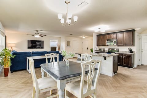 With a table and four chairs, the dining area is perfectly equipped for family meals or intimate dinners.