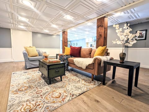 Gorgeous, airy living room space with comfortable couch and armchair