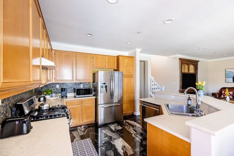 Fully furnished kitchen with stainless steel appliances
