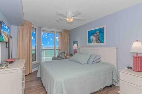 Master bedroom with king-size bed includes ocean views, direct balcony access and adjacent bathroom!