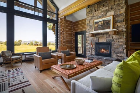 Gather by the glowing fireplace and watch the view unfold.