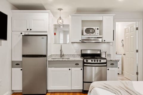 Kitchen with essentials. Glassware, utensils, baking sheets, cutting boards, and more. (1)