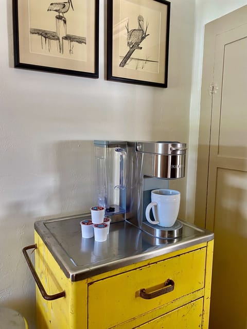 Brew fresh coffee on vintage cabinet, start your day with convenience and charm.