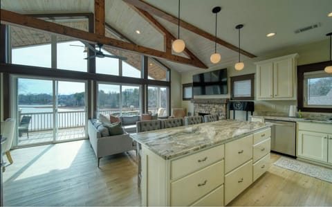 Open Concept takes in all the views. Fully stocked gourmet kitchen.