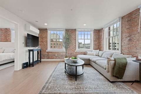 Relax in style—cozy seating with curated art and design accents.