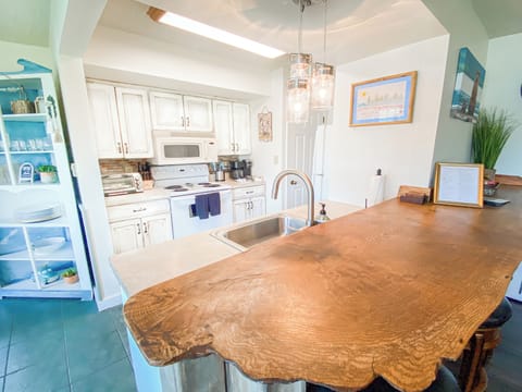 Enjoy your morning coffee on our custom natural wood edge breakfast bar