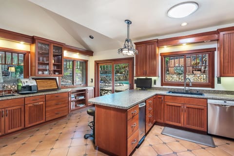 Ample counterspace, bar/counter seating, and tons of light means everyone can prep meals.