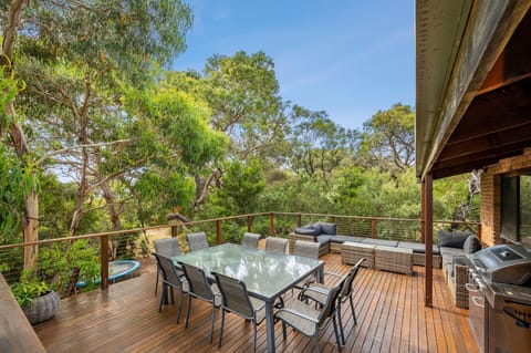 In the trees on the second floor deck - relax and have a BBQ! Table seats 10.
